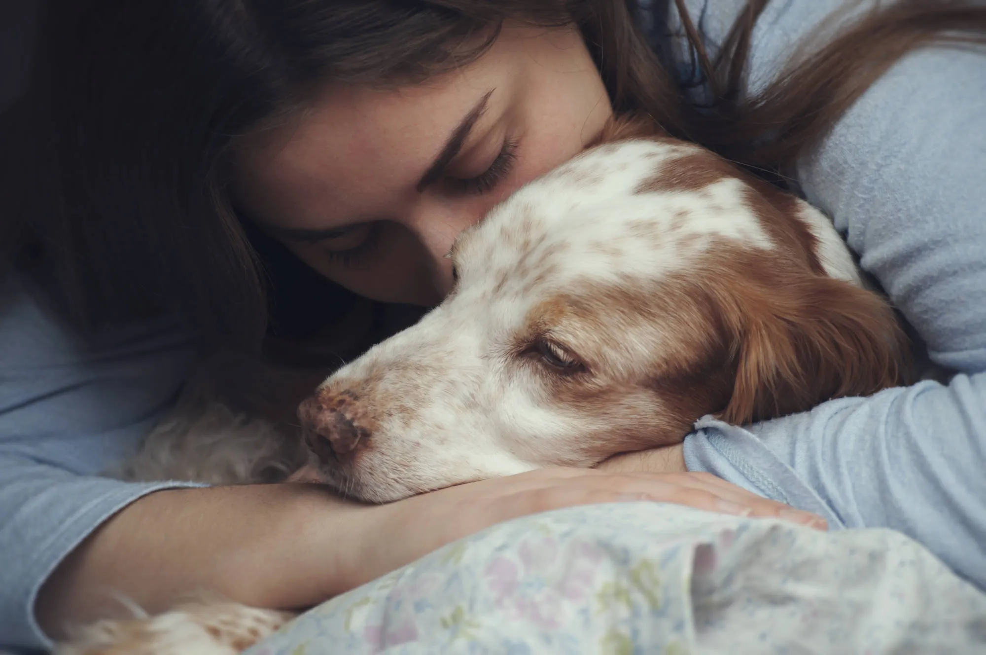 Woman hugging dog